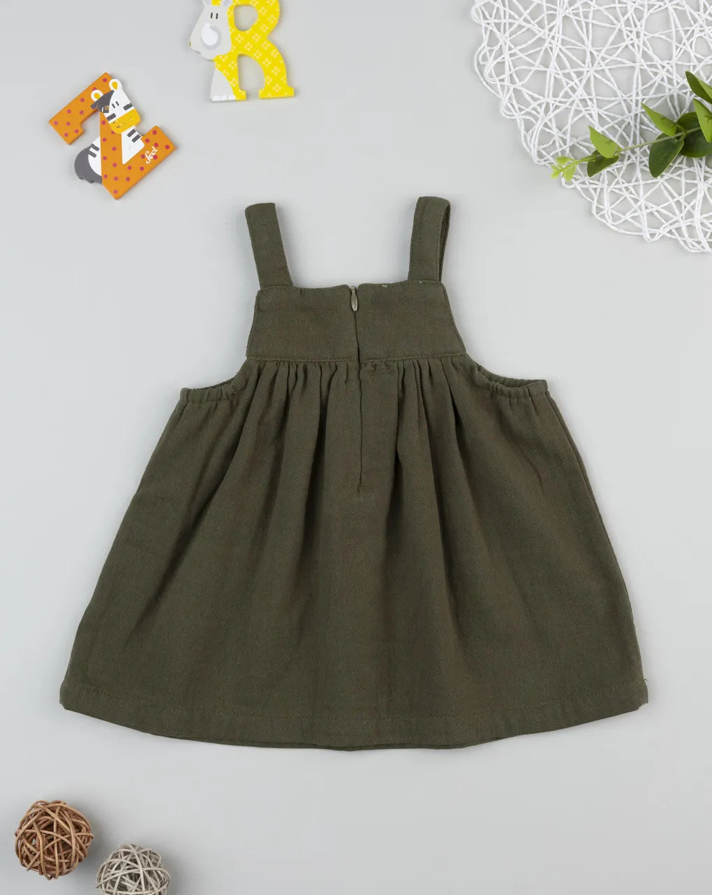 Prenatal Green girl's smock with embroidery