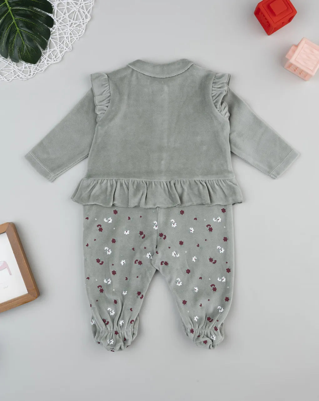 Prenatal Green baby romper with flowers and frills