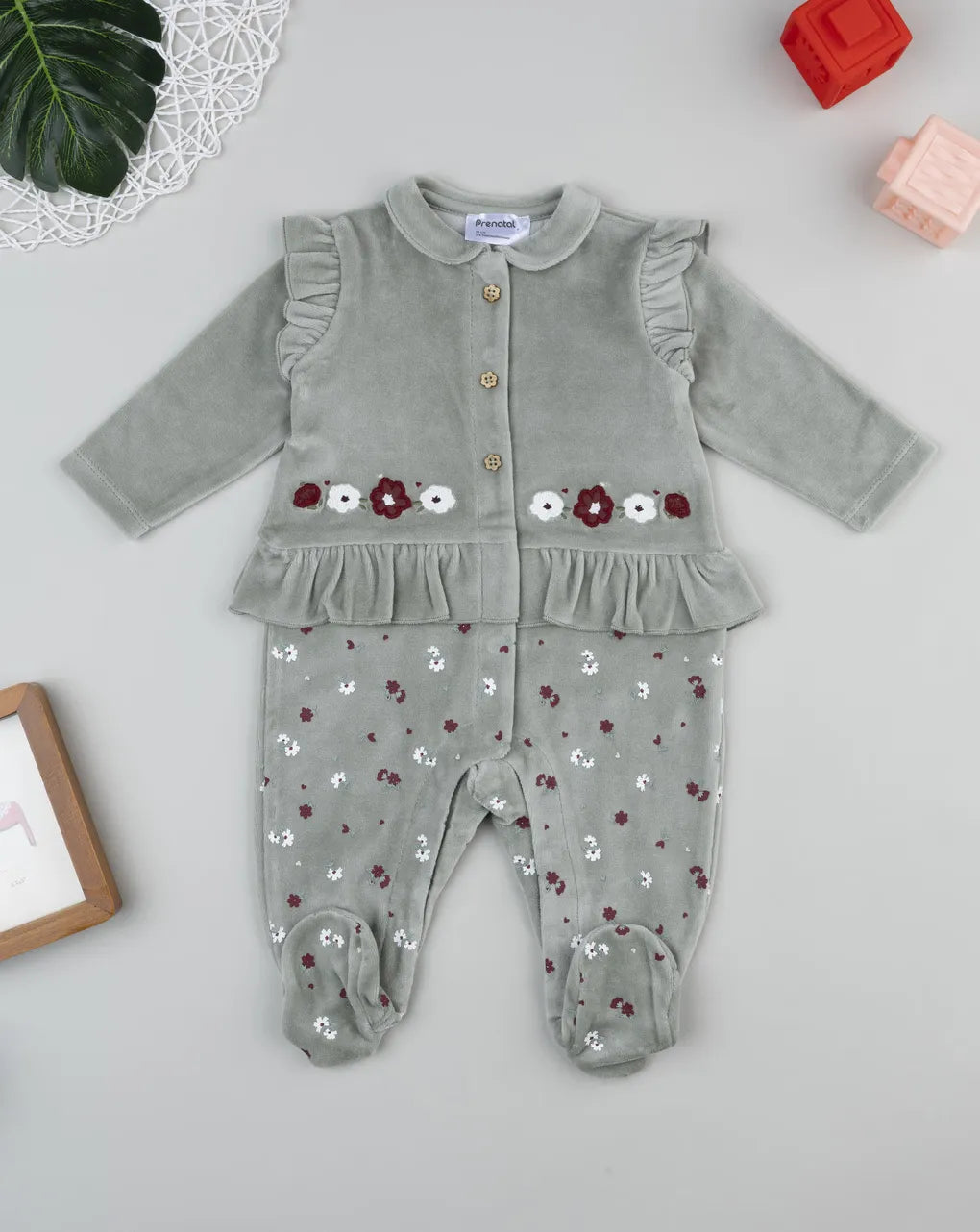 Prenatal Green baby romper with flowers and frills