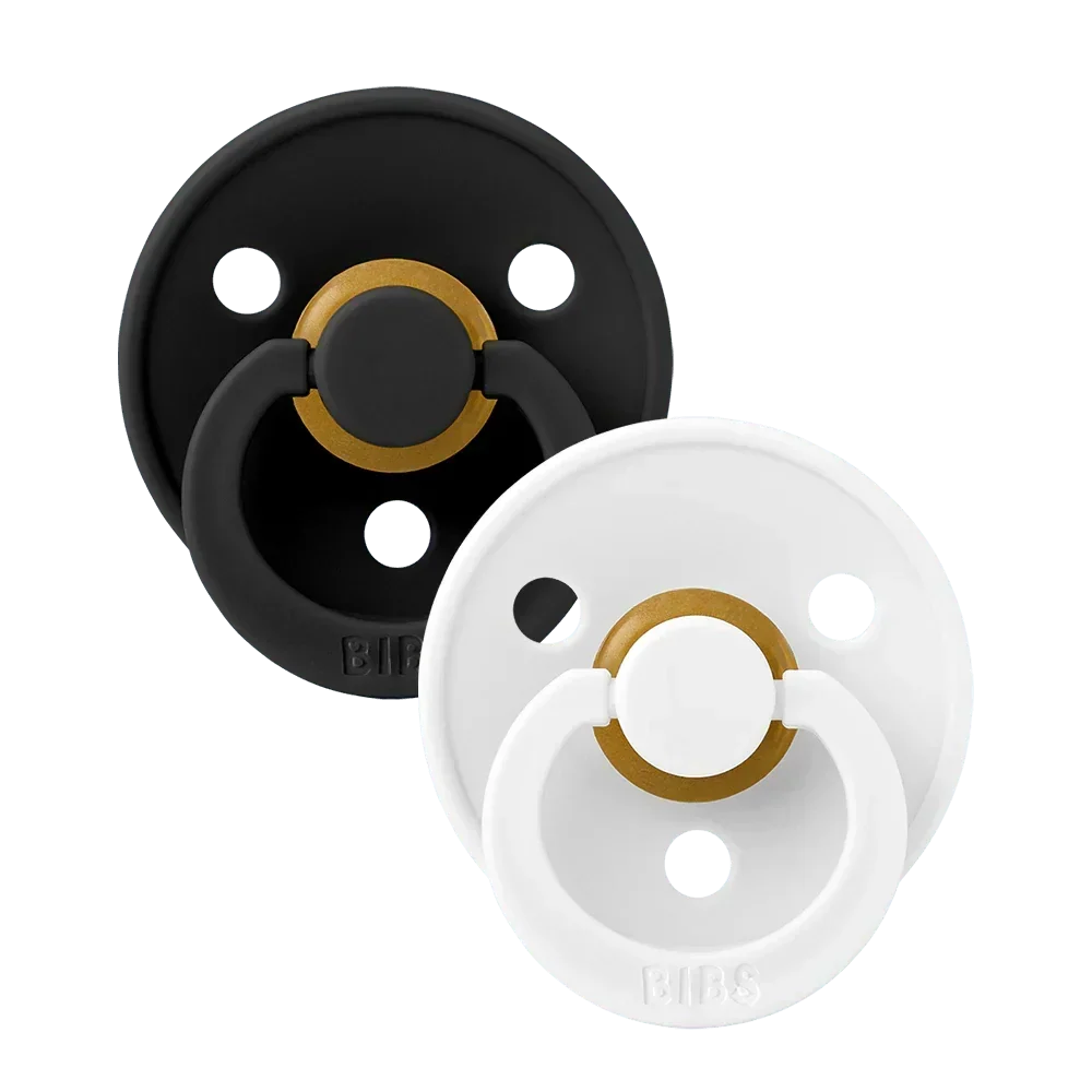 Two latex pacifiers, black and white shields with gold ring, size 2 (6–18 m)