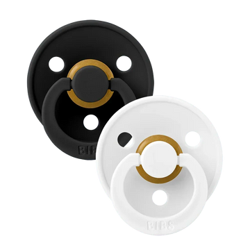 Two latex pacifiers, black and white shields with gold ring, size 2 (6–18 m)