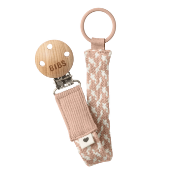 Woven pacifier clip with blush-and-ivory strap, BIBS tag, and metal clasp