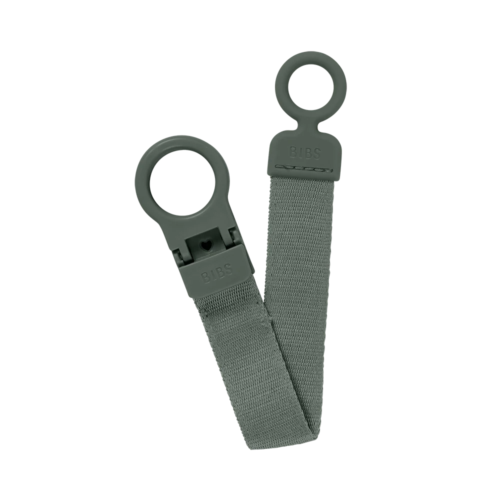 Sage green pacifier clip with two loop rings and BIBS logo tag