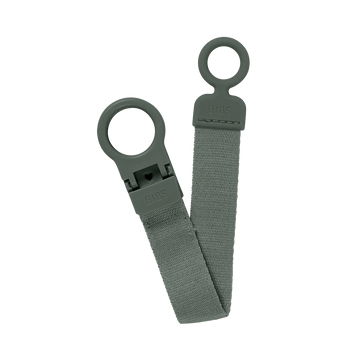 Sage green pacifier clip with two loop rings and BIBS logo tag