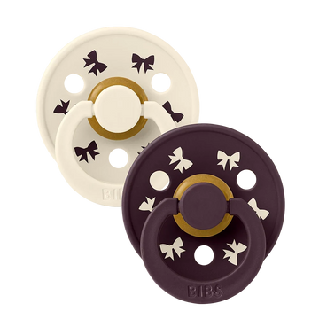 2-pack latex pacifiers, ivory and plum with star accents and shield base