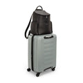 Black caviar-style backpack attached to light gray wheeled case with handle and strap