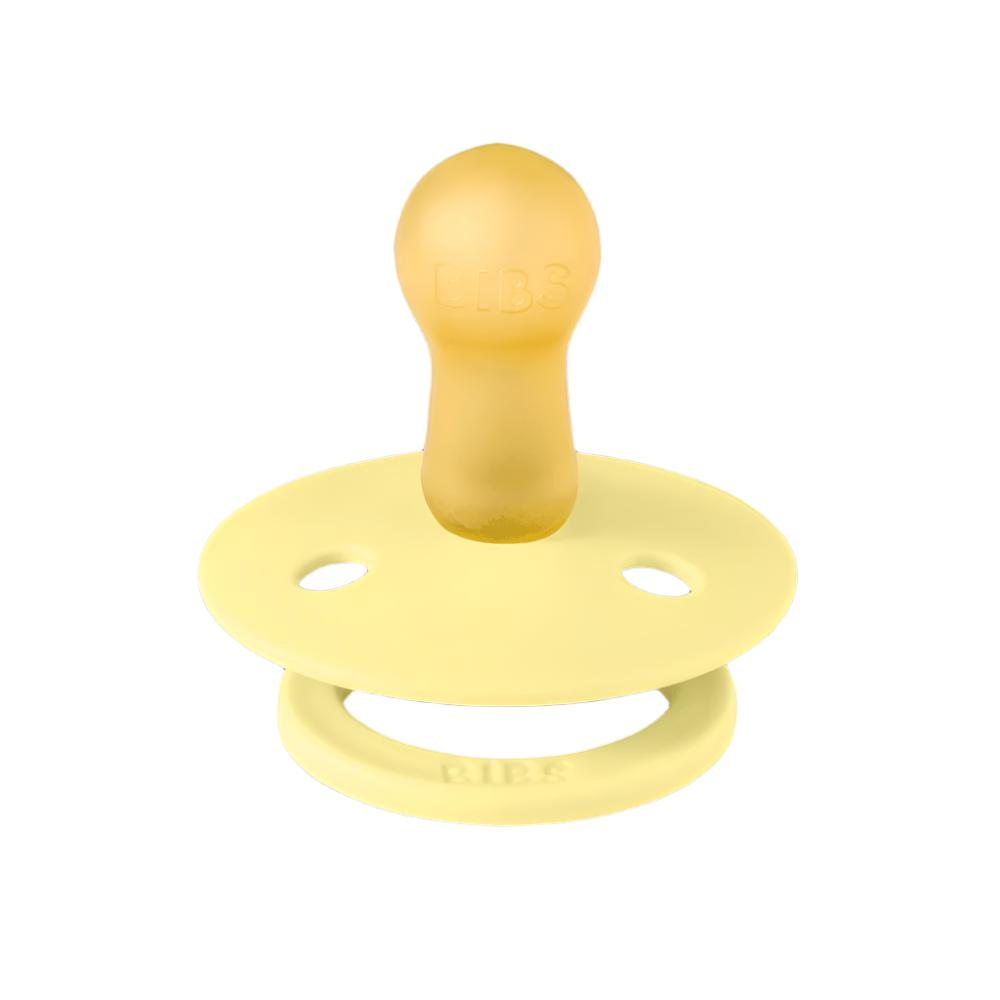 Two silicone pacifiers: one yellow and one lavender, round shield with ventilation holes