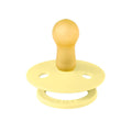 Yellow silicone pacifier with round shield and ventilation holes