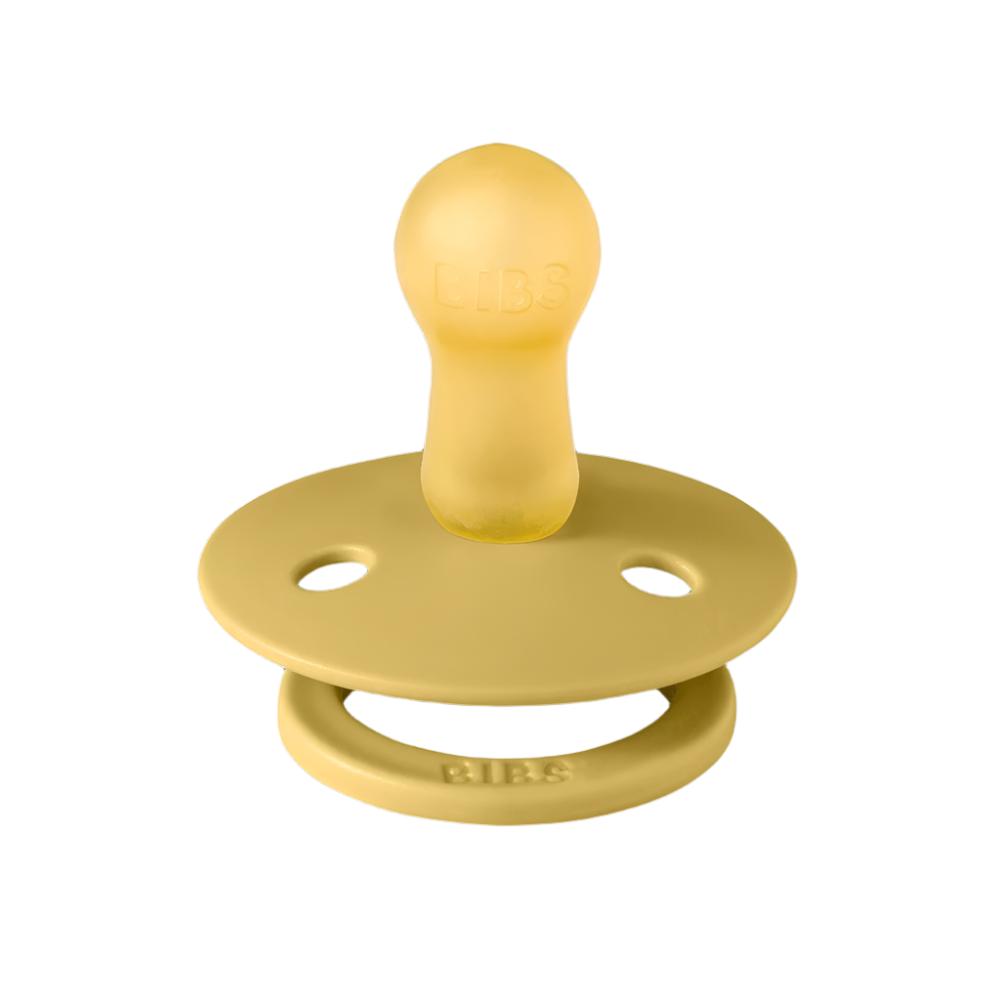 Two pacifiers, one beige and one mustard, each with round shield and vent holes