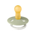 Pacifier with pale yellow shield and pale green round base with two air holes