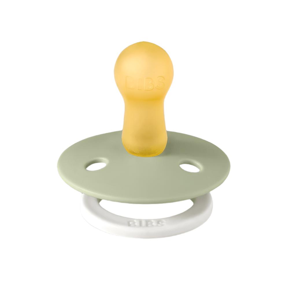 Pacifier with pale yellow shield and pale green round base with two air holes